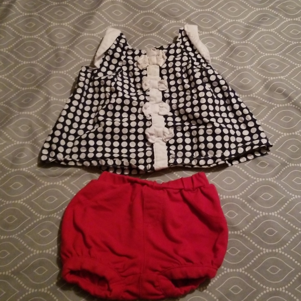 Navy blue pole dot top with red bottoms.